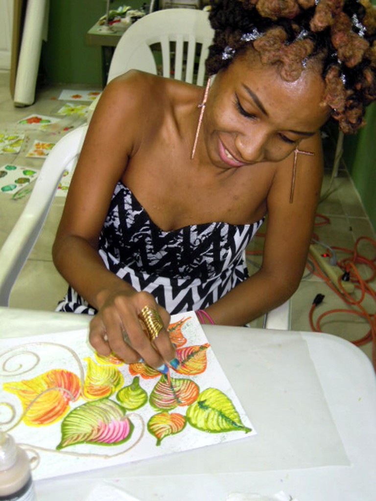 Student learning to paint textured floral designs